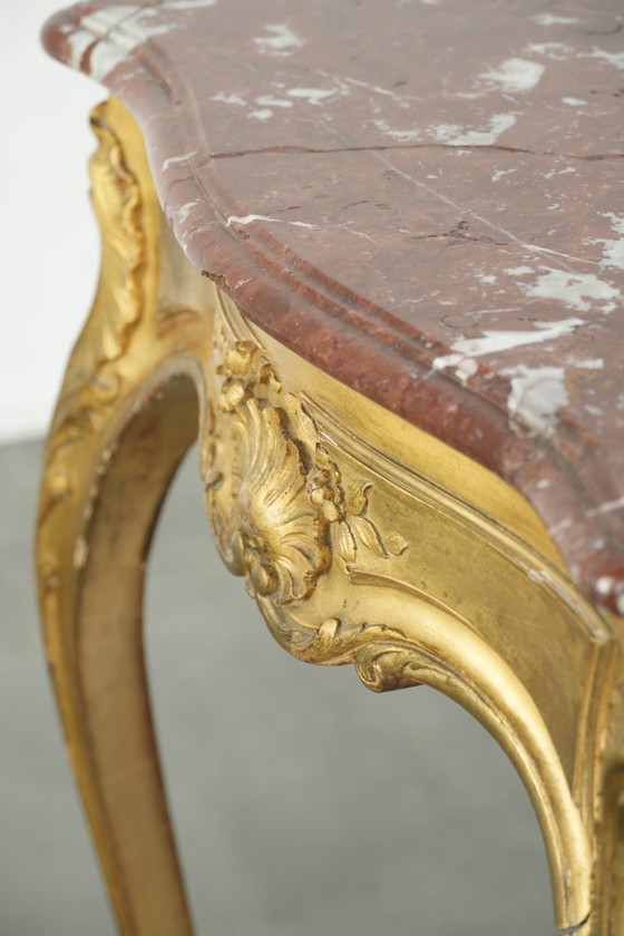 Image 1 of Antique French side table/center table from the 19th century with a gold-colored wooden frame and an original marble tabletop.