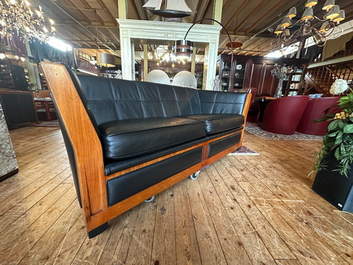 Sofá Schuitema Lawrence de 2,5 plazas – Decoforma – Bubinga y cuero negro