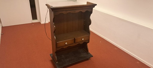 Vintage wooden cabinet with drawers and ribbed edge