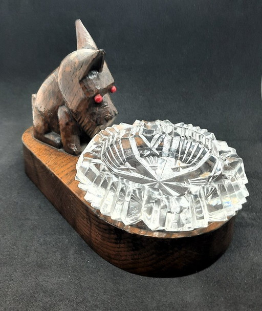Vintage Black Forest wood carving dog and crystal ashtray.