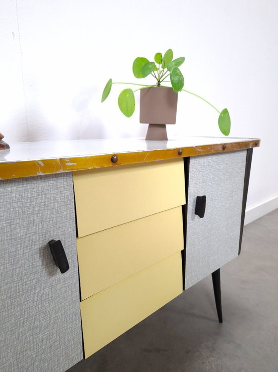 Image 1 of 1950s light blue-yellow cabinet with Formica and slanted legs