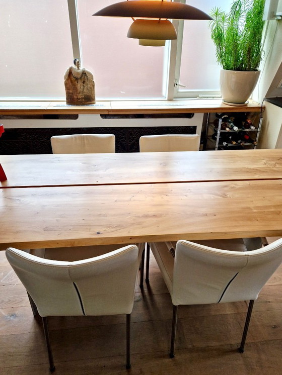 Image 1 of 4 dining room chairs upholstered in white leather