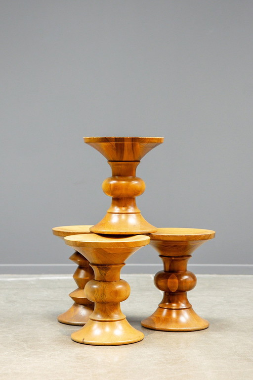 Eames walnut stools, A, B