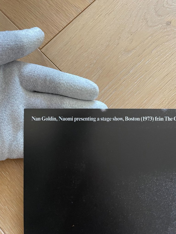 Image 1 of Nan Goldin, exibition poster  “This Will Not End Well” Naomi presenting a stage show, Boston (1973) fran The Other Side, 1992-20