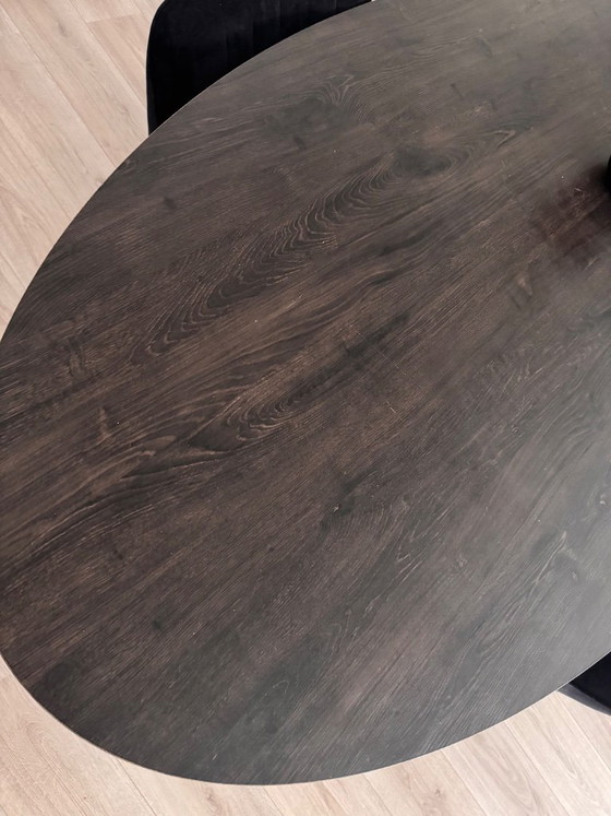 Oval dining table with dark brown top and black base, Haco, Wood, Metal, Modern (photo 5 of 7)