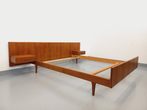 Vintage Scandinavian teak double bed from the 1960s with integrated bedside tables