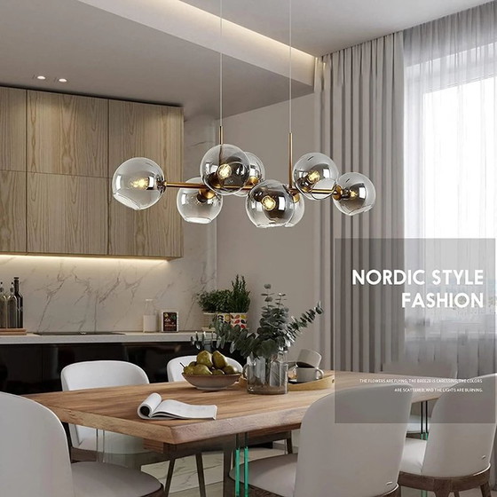 Image 1 of Dining room chandelier Illuminate your dining room with this modern chandelier composed of seven smoked glass globes. Its refine