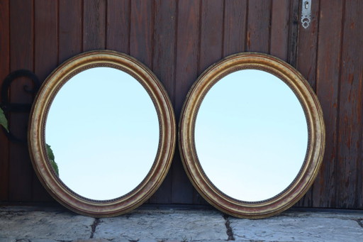 Pair of oval Louis Philippe period mirrors in giltwood