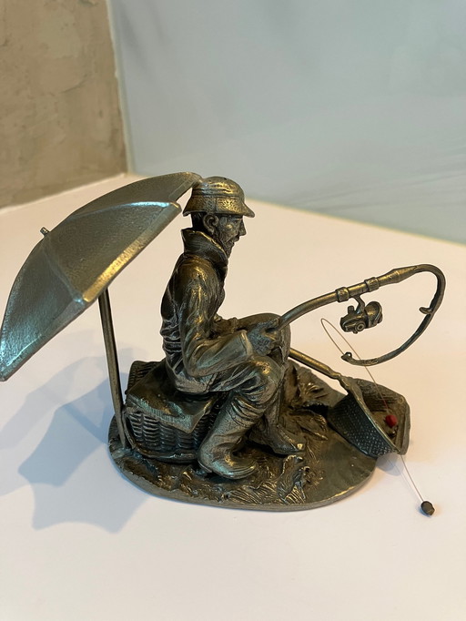 Tin Statue of a Fisherman