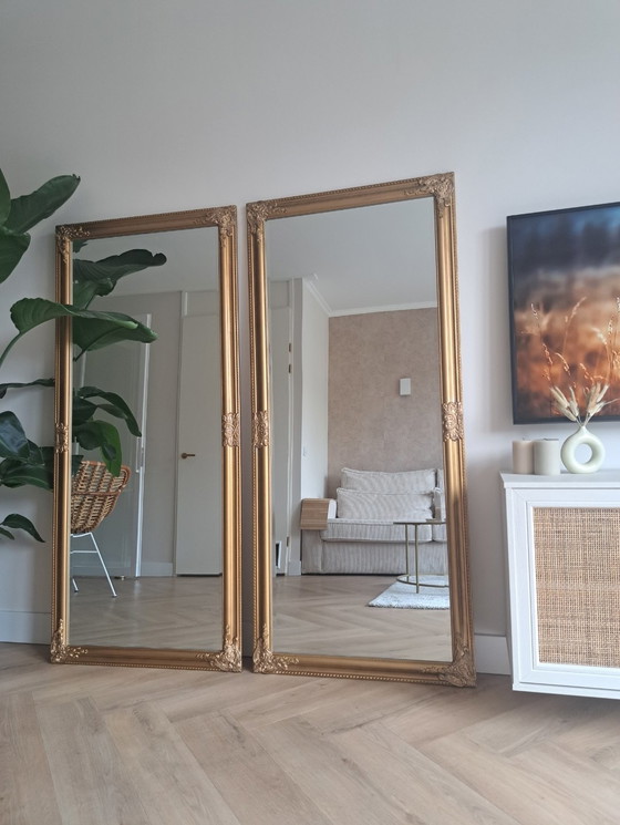 Image 1 of 2 grote antieklook spiegels met goudbronze lijst