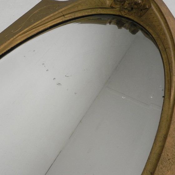 Image 1 of Gold oval mirror with cut edge, 1950s