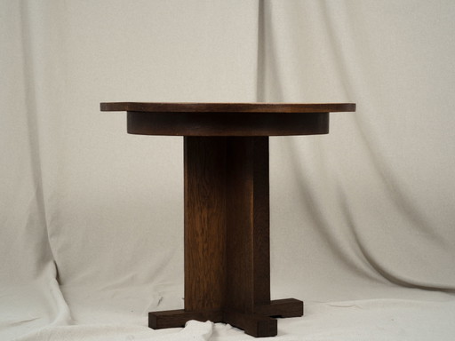Tavolino laterale rotondo scultoreo in legno