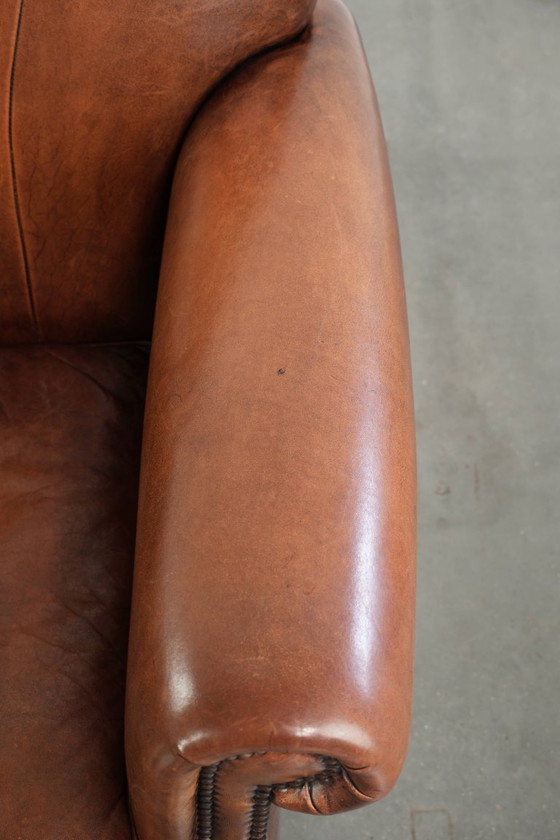 Vintage schapenleren armchair met een comfortabele zit en afgewerkt met siernagels – Fauteuils, Leather (photo 8 of 14)