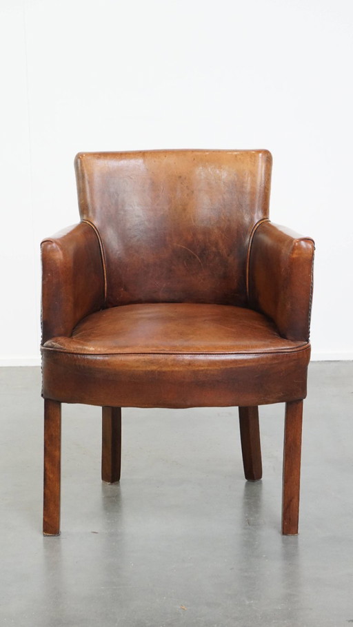 Cognac colored sheep leather dining/side chair with armrests