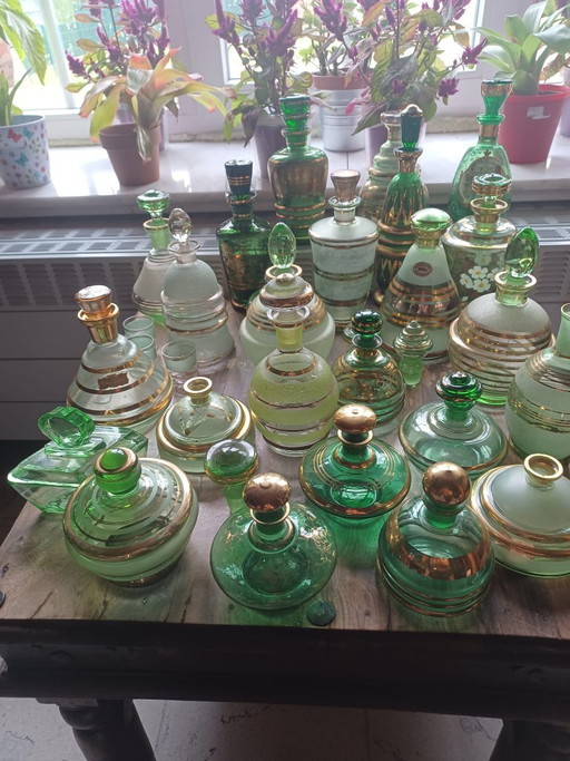 Huge vintage green gold glass collection, 50s Booms glass decanters and vanity jars lot De Rupel