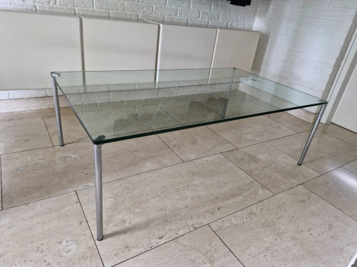 2 sleekly designed glass coffee tables