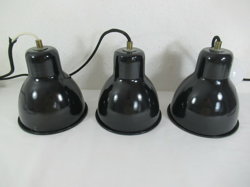 Set of three industrial-style ceiling lights made of black and white metal