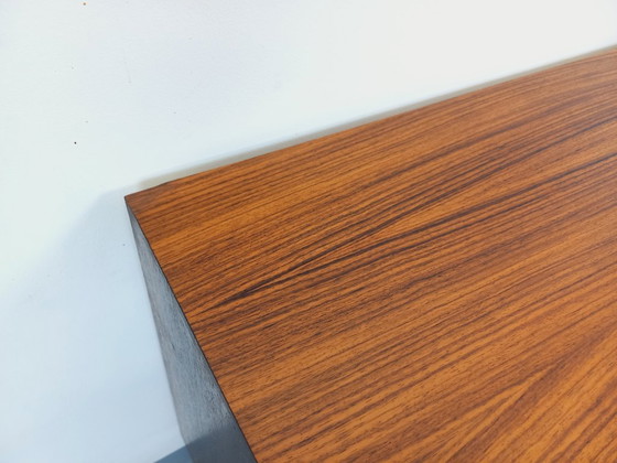 Image 1 of Vintage Scandinavian modernist style chest of drawers in rosewood and black metal from the 1960s
