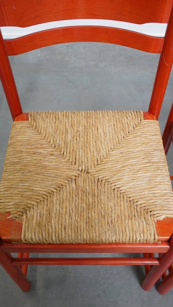 Image 1 of 2 x Sedia vintage rossa in legno degli anni '70 con seduta in vimini intrecciato