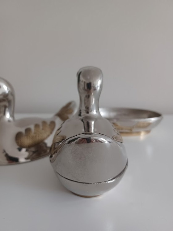 Image 1 of Vintage koppel tinnen eendjes met koper. Opbergdoosjes.