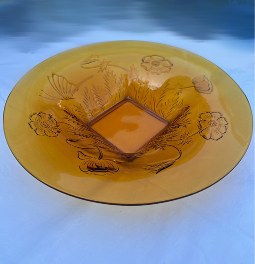 Vintage amberkleurige schaal met bloem en bladmotief