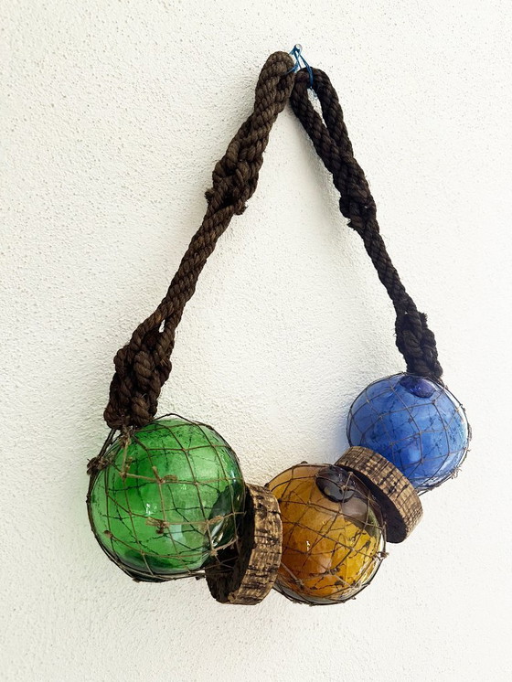 Image 1 of Fishing float made of blown glass, cork, and rope. France, 1960s