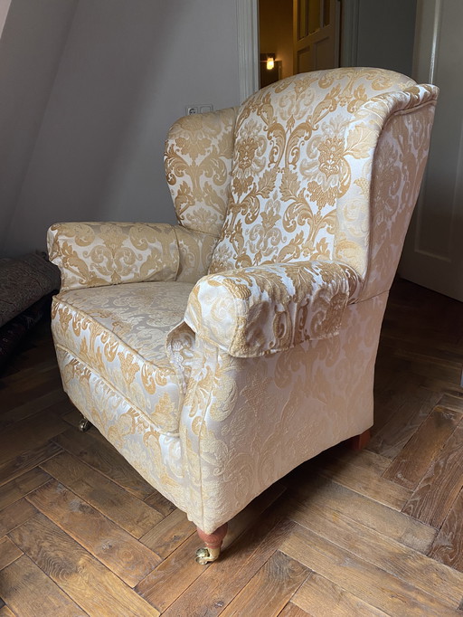 Fauteuil à oreilles avec pouf