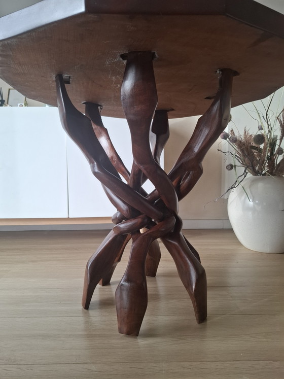 Image 1 of Interlocking African "unity" table.