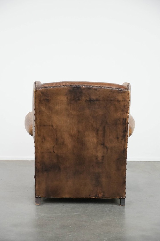 Image 1 of Ohrensessel im englischen Stil aus Kuhfell