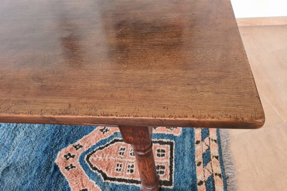 Image 1 of Massief eikenhouten eettafel met 6 bijpassende stoelen 