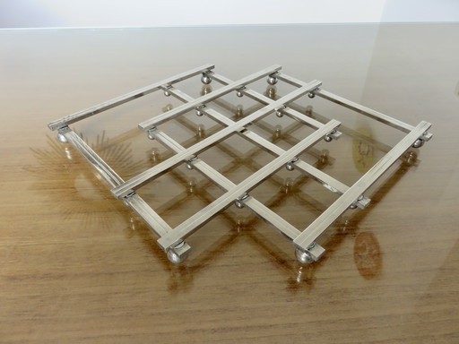 Dessous de plat extensible Jacques Adnet, en métal argenté, 40s 50s