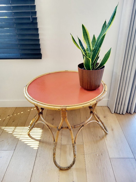 Image 1 of Rattan Couchtisch Modell Diabolo, Design KOK mit orangefarbener Platte