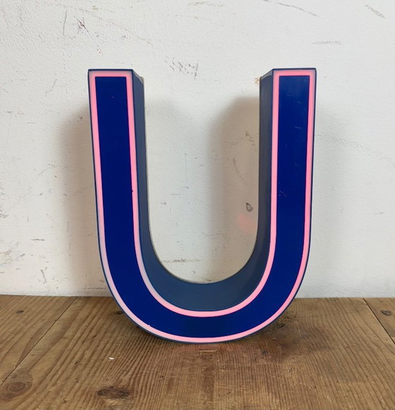 Image 1 of Industrial dark blue enamel factory pendant light made in United Kingdom during the 1950s. White enamel inside the shade. Brass 