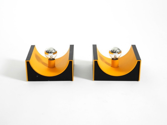 Image 1 of A rare pair of original 1960s Space Age metal wall lamps by Klaus Hempel for Kaiser Leuchten in yellow and black