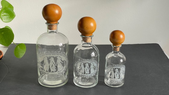 Image 1 of Vintage Engraved Glass and Wood Bottles