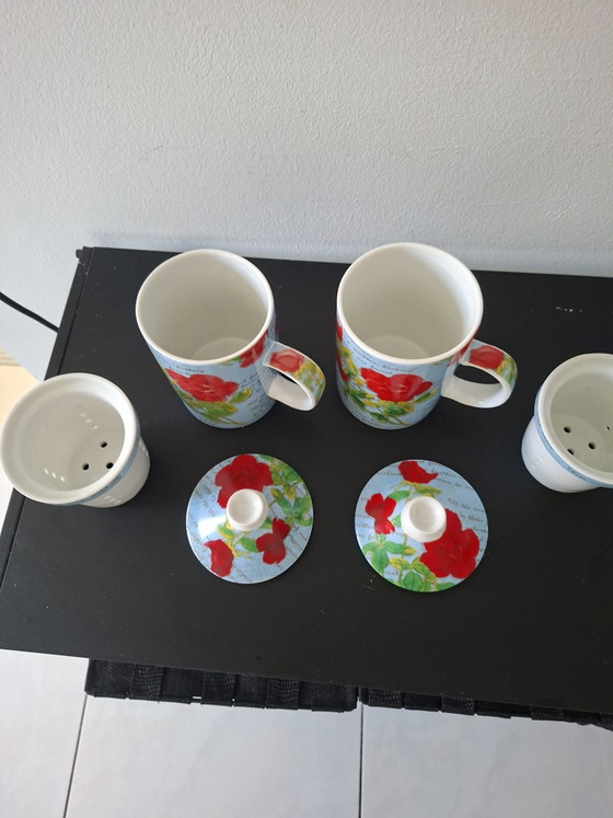 Image 1 of Tazza da tè in ceramica con coperchio e filtro.