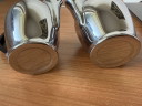 2 vintage Carlo Alessi stainless steel milk jugs with rounded tops and Bakelite handles.