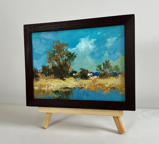 Image 1 of Origineel olieverfschilderij: Kustlandschap langs een rivier, wandelend nabij een bosvijver.