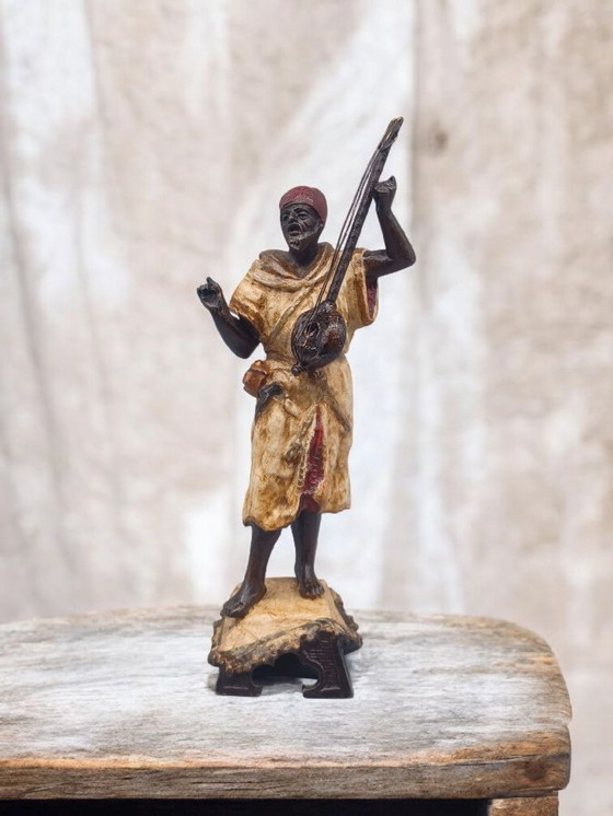 Image 1 of Ecole Orientaliste du XXème siècle, Musicien de rue en métal belle patine