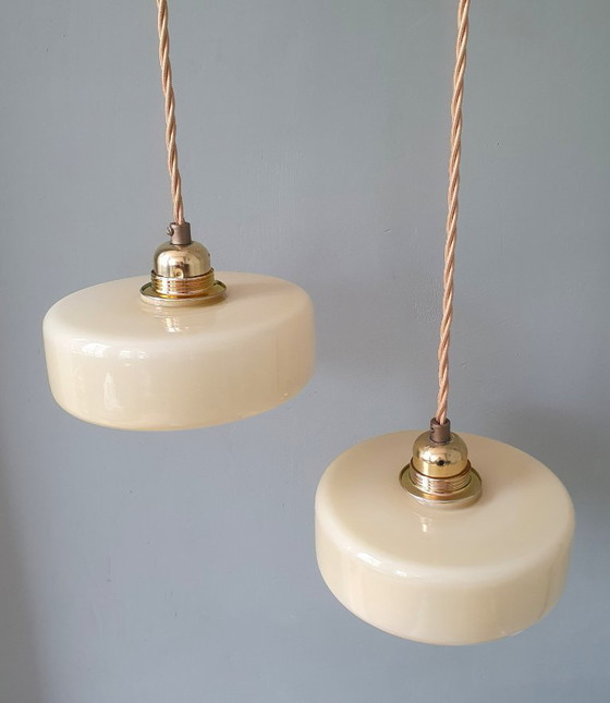 Image 1 of Vintage pendant lamp set (2) of yellow pastel opaline glass. Art Deco design.