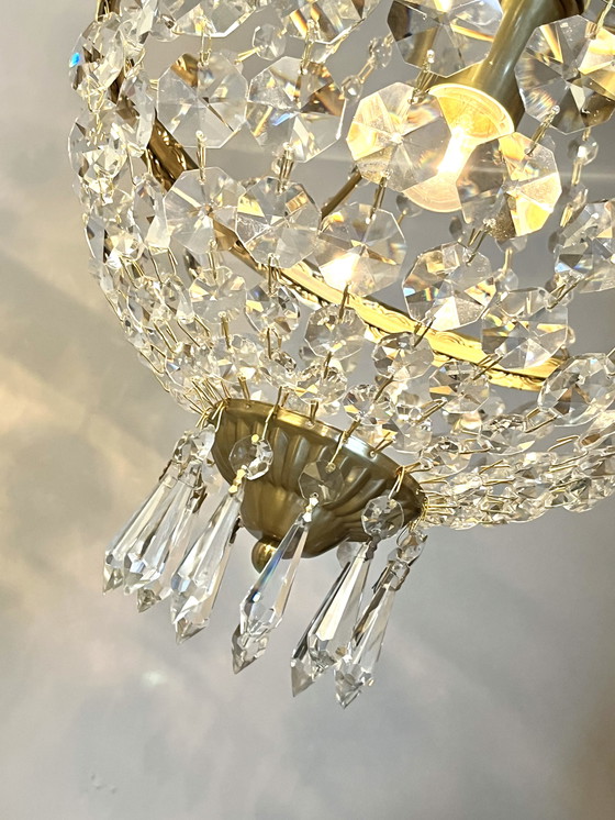 Image 1 of Lampadario con struttura in oro e 4 luci a forma di borsa di cristallo