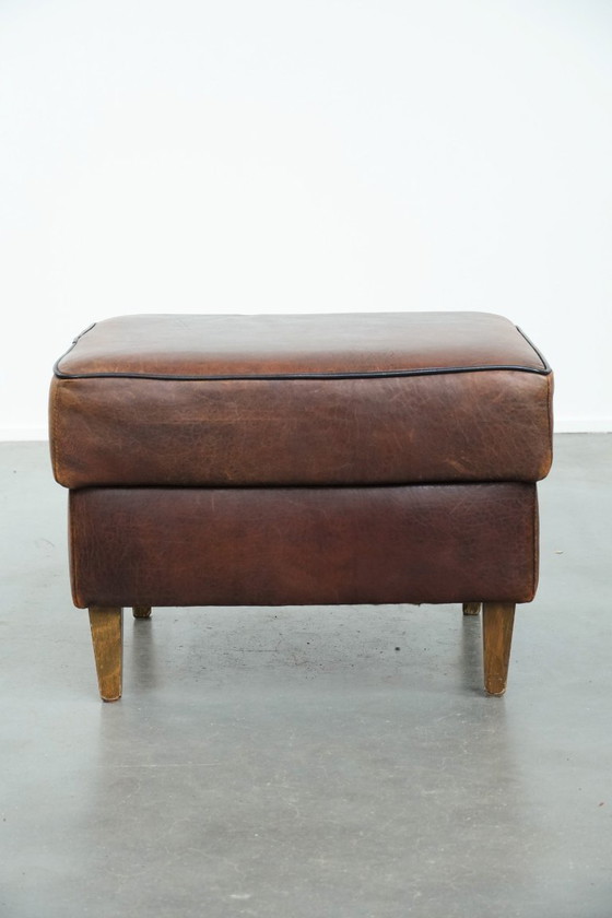 Image 1 of Vintage sheepskin stool with black piping