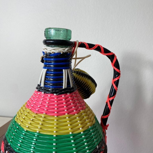 Vintage glass bottle and plastic braided scoubidou
