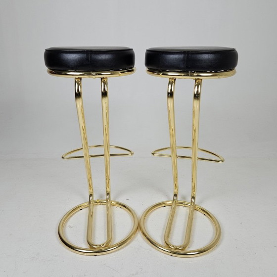Image 1 of two bar stools, distinguished by their clean lines, high-quality craftsmanship, and timeless elegance.