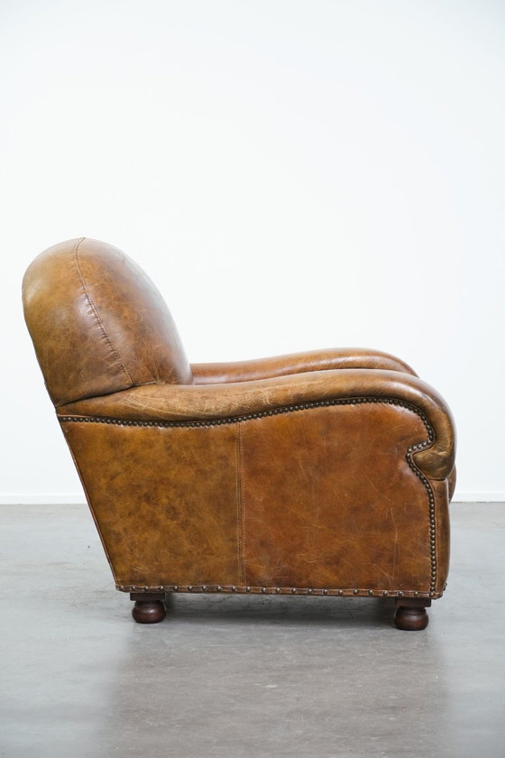 Image 1 of Vintage generfde rundleren fauteuil met ronde vormen
