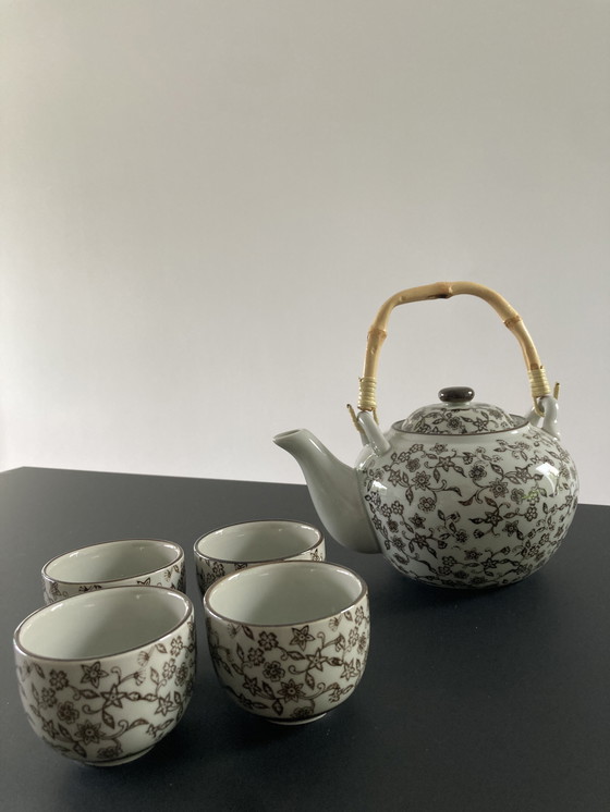 Image 1 of Gray ceramic tea set with brown floral pattern, four cups and a teapot