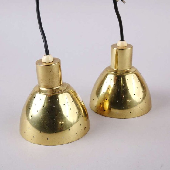 Image 1 of Hans-Agne Jakobsson for Markaryd – Pair of T618 perforated brass pendant lights – Sweden, 1960s