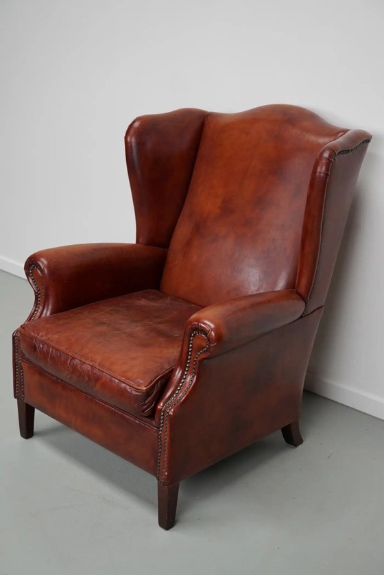 Image 1 of Vintage Nederlandse cognackleurige leren clubfauteuil met vleugelrug
