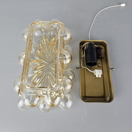 Image 1 of Vintage glass bubble wall lamp by Glashutte Limburg. Design by Helena Tynell. Glass and brass. 1960, Germany.