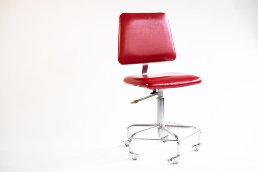 Red vintage swivel chair